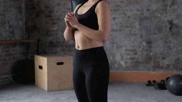 Close Up Sporty woman is training making squats in Gym. Sporty girl having workout alt