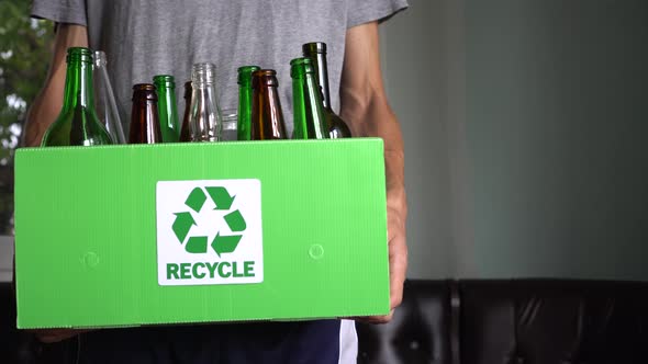 Separate bin for glass recycling. Container for glass bottles and jars at home. Zero waste  alt