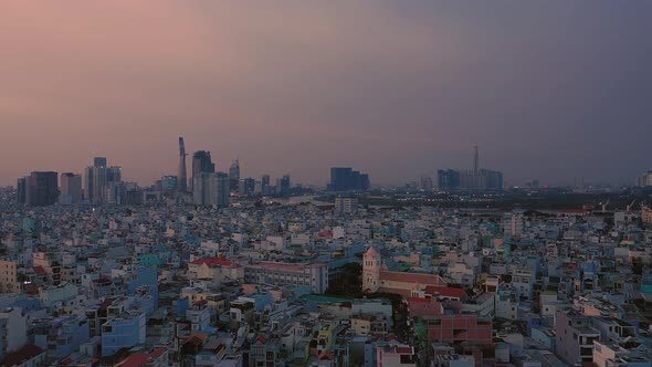 Evening reveal shot as camera moves in over a residential area and up to a high angle revealing the alt