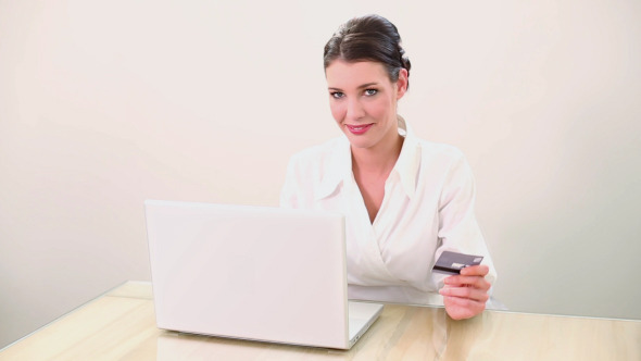 Beautiful Brunette Shopping Online With Laptop alt