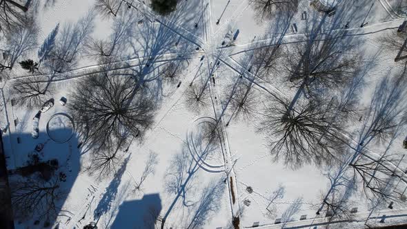 Top view of city park and clock tower in the winter alt