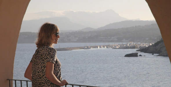 Blonde Girl Looks At The Beach