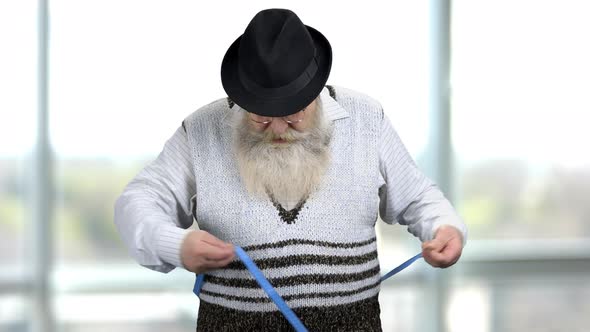 Portrait of an Old Retired Man Measuring His Waist and Disappointing alt