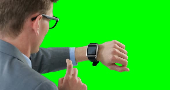 Businessman using smartwatch alt
