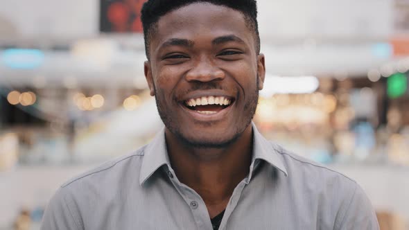 Closeup Young African American Guy Looking at Camera Posing Smiling Toothy Dental Smile Emotional alt