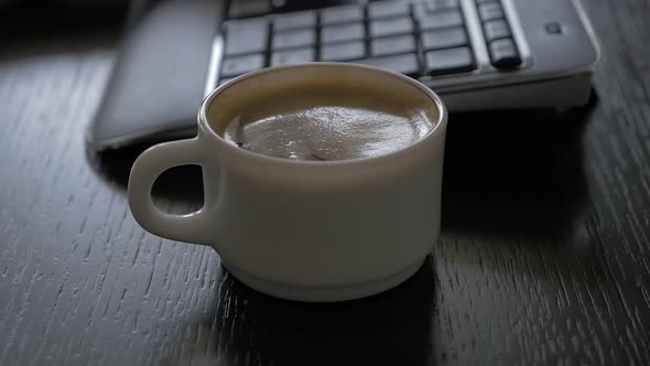 Working place coffee cup taking after  keyboard typing high definition 1080p FullHD slow-mo   footag