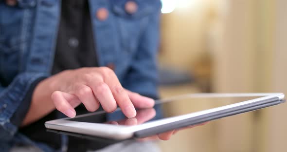 Close up of woman using digital tablet alt