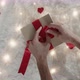 Close Up of Hands Preparing Red Bow for Gift Box - VideoHive Item for Sale