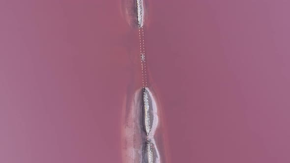 Aerial Shot of a Sand Spit Surrounded with Light Violet Waters in the Black Sea  alt