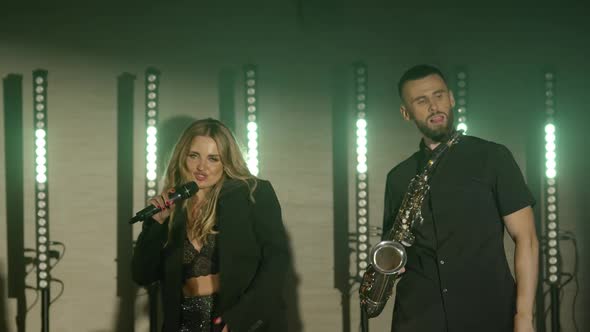 Musical Band Group of Two People Playing Music Song Performing on Concert Musician Light Stage alt