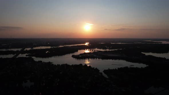 Aerial Beautiful View Of The Kyiv City And Dnieper River And At Sunset