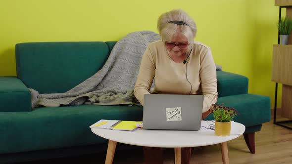 Old Woman Very Charismatic Using Her Laptop While