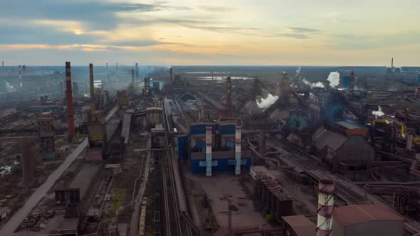 Aerial Hyperlapse Time Lapse. Steel Factory Pipes During Sunrise Time. High Above Metallurgical