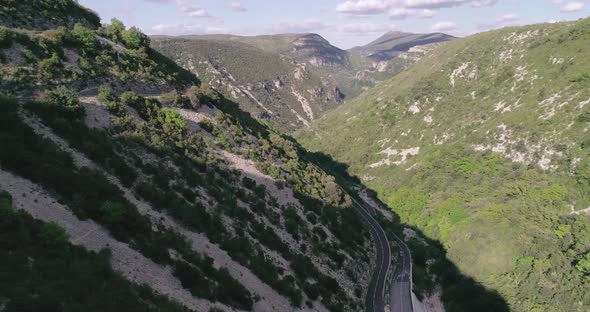 Drone Shot Flying Over Beautiful Mountain Ridge and Clouds in Rural Environment alt