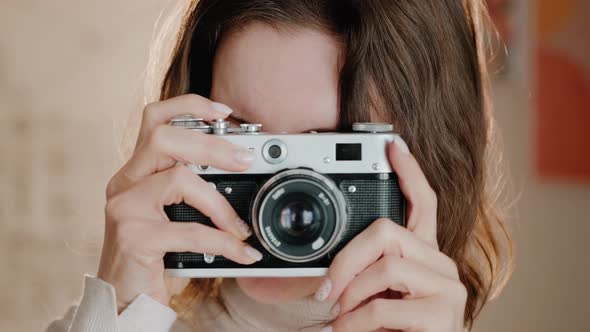 Portrain of Young Woman Taking Pictures.