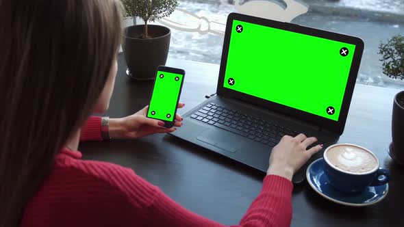 The Girl In The Cafe Works With Gadgets With Green Screens