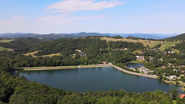 Aerial view of Vindsachtske lake in the village of Stiavnicke Bane in Slovakia alt