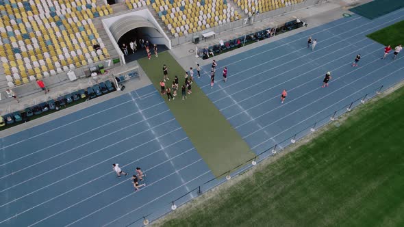 People Running on the Stadium Aerial View