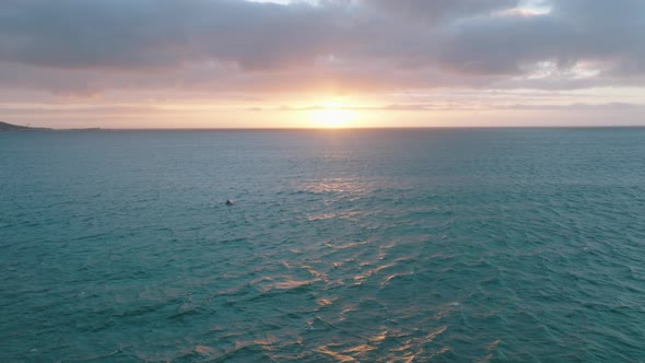 Backwards Fly Above Rippled Sea Water in Evening alt