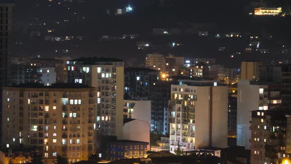 Multistorey Buildings with Changing Window Lighting At Night in City. Timelapse alt