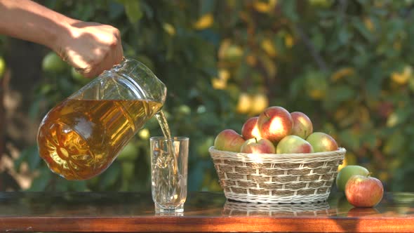 Apple juice and basket with apples