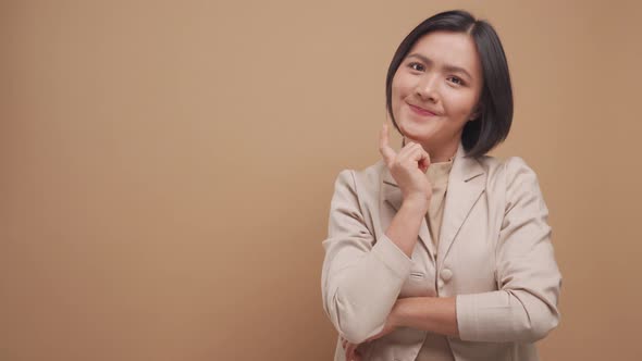 Happy business asian woman have a good idea crossed arms standing with copy space isolated