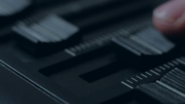 Professional Sound Engineer Balancing Volume of Audio Inputs of Digital Audio Mixer alt