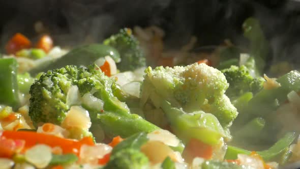 Lunch of Vegetables. Cook the Vegetable Stew in a Pan. Frozen Vegetables on a Salad. Semi-finished