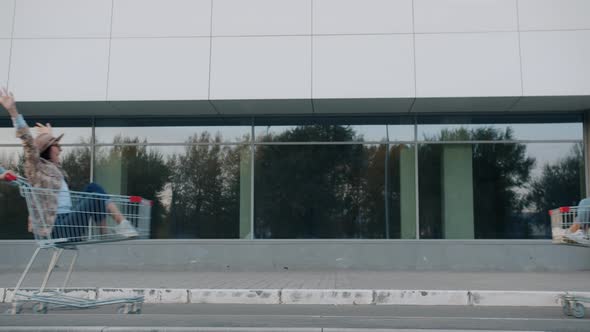 Playful Youth Young Couples Running Riding Shopping Carts Enjoying Leisure Time alt