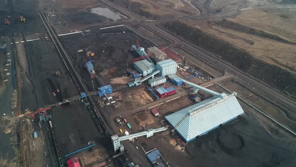 Top View of Heavy Commercial Vehicles Working on Territory of the Processing Plant