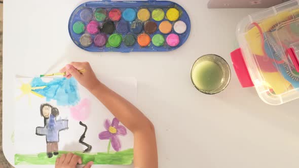 Close Up Talented Little Girl Female Artist Draws Mother Sun Summer Flover Drawing at Home