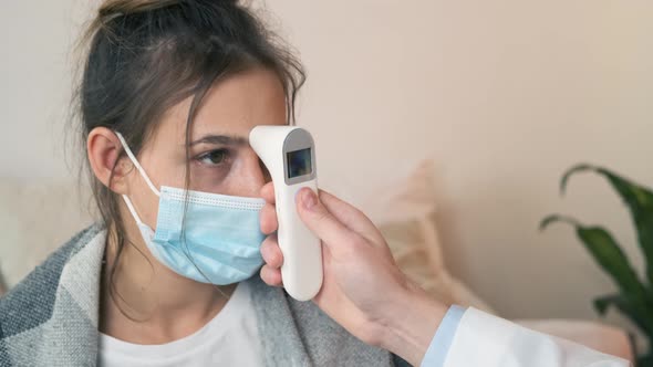 The Doctor Measures the Temperature of a Noncontact Infrared Thermometer