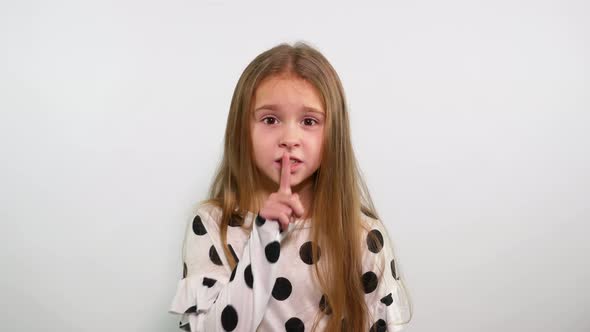 Cute Blonde Teenage Girl Making Gesture of Silence. Irritated Face Shushing alt