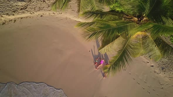 Family on beach at Seychelles aerial top view