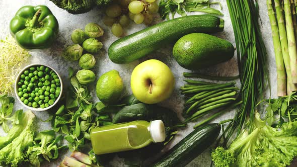 Green Antioxidant Organic Vegetables, Fruits and Herbs Placed on Gray Stone alt
