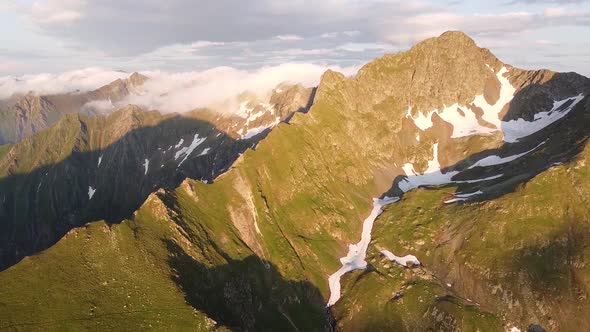 Fly In Mountain Range With Clouds