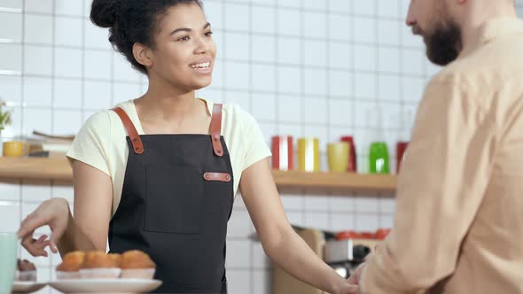 Waitress Serving Customer in The Coffee Shop