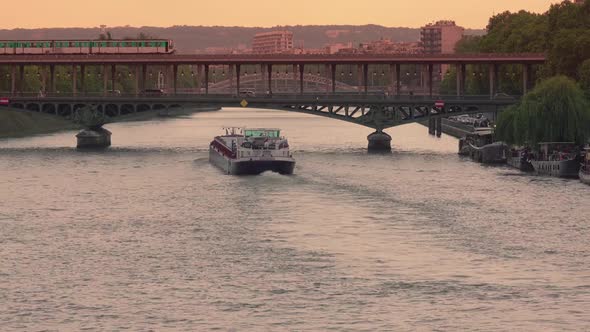 Barges on the Evening Seine and Bridges