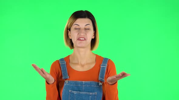 Girl Says Wow, Waves His Head Approvingly and Shows Thumb Like Sign. Green Screen alt