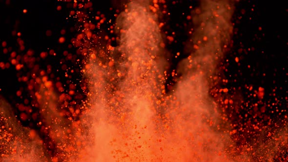 Super Slowmotion Shot of Color Powder Explosions Isolated on Black Background alt