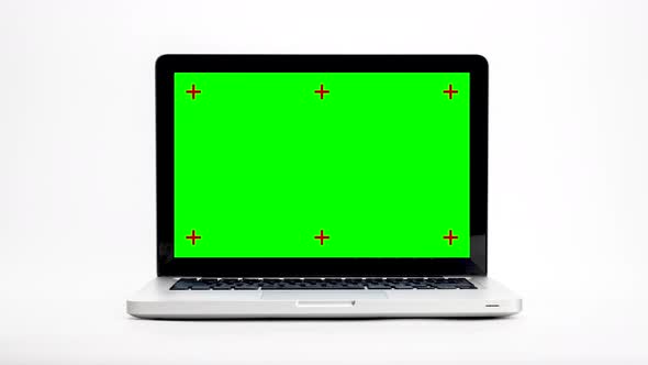 Stop motion animation green screen laptop computer turning isolated on white background.
