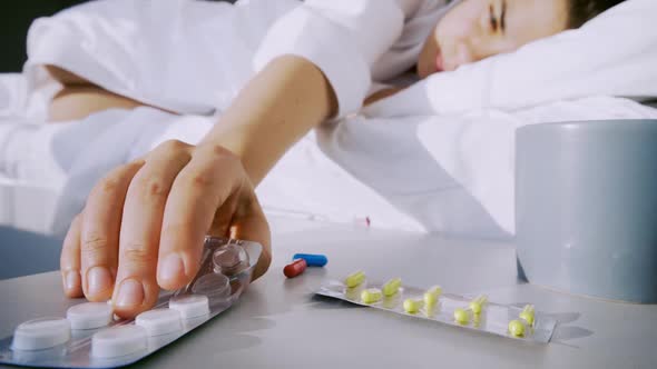 Lady Choose Pill and Takes Blue Capsule From Table