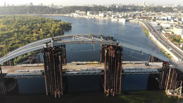 Aerial View of the Unfinished PodolskoVoskresensky Bridge Across the Dnieper River in Kiev Ukraine alt