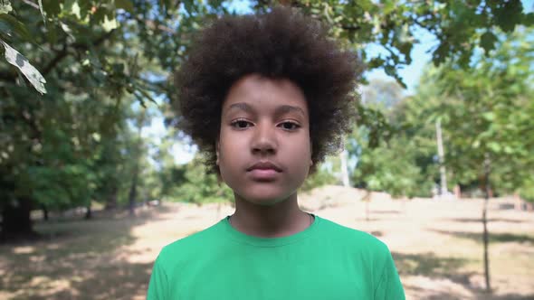 Mixed Raced Boy Feeling Surprised, Touching Face With Palms, Shock Content