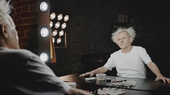 Exhausted Mime Sits Down at Table Training Facial Expression alt