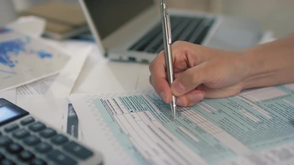 Doing Tax Return Indoors alt