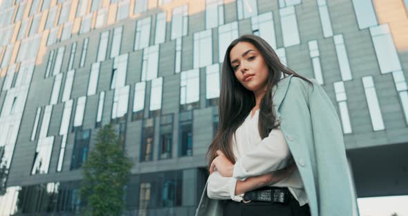 Pretty Brunette Businesswoman Secretary in Daily Makeup Woman Wearing White Shirt with Jacket Thrown alt