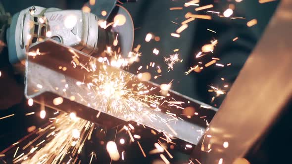 Slow Motion Video of Rotary Saw Is Cutting Iron and Causing Sparks alt