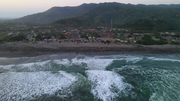 Aerial panorama of Parangkusumo beach on Java island during kite festival alt