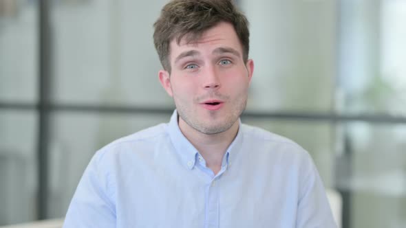 Portrait of Young Man Talking on Online Video Call alt